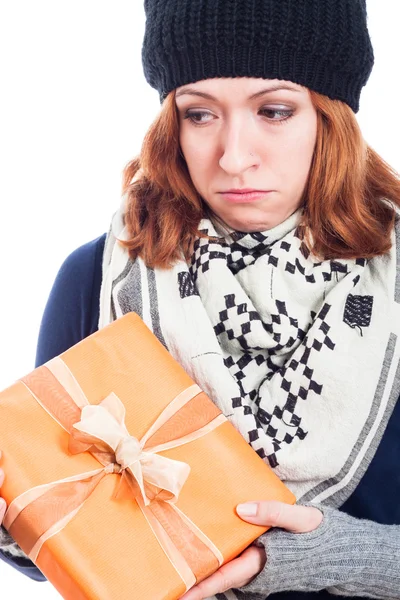 Unhappy woman with present — Stock Photo, Image