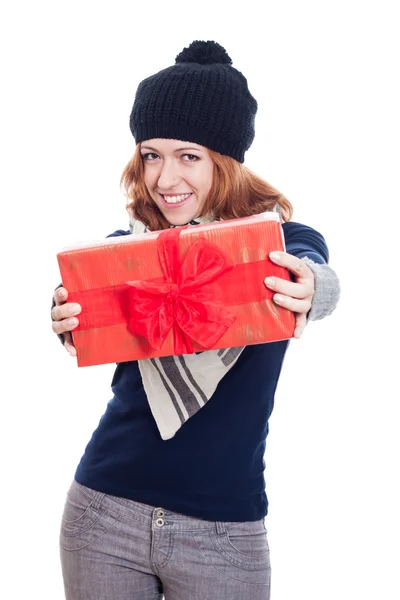 Happy winter woman showing present — Stock Photo, Image