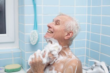 Senior man bathing clipart