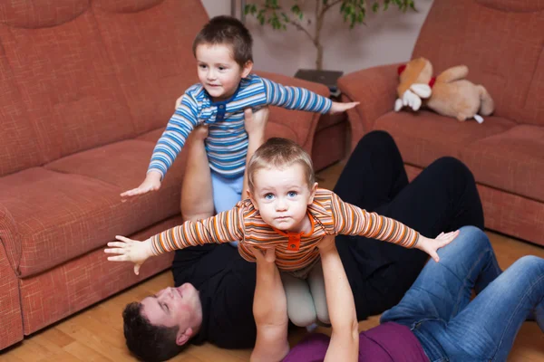 Happy family playing at home — Stock Photo, Image