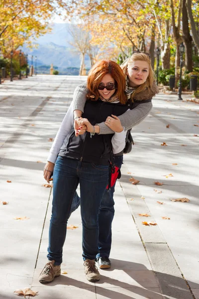 Happy girlfriends in park — Stock Photo, Image