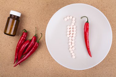 Red chili pepper with vitamins clipart