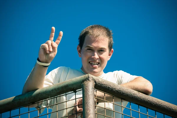 Happy man gesturing v sign — Stock Photo, Image