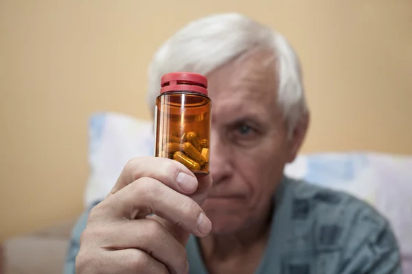 Ill senior with pills — Stock Photo, Image