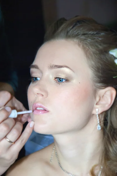 Bride getting make up on