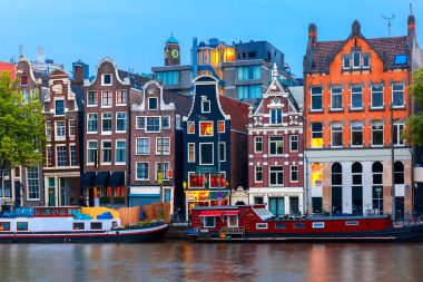 Night city view of Amsterdam canal with dutch houses clipart