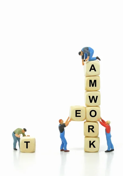 Mini workmen in teamwork concept — Stock Photo, Image