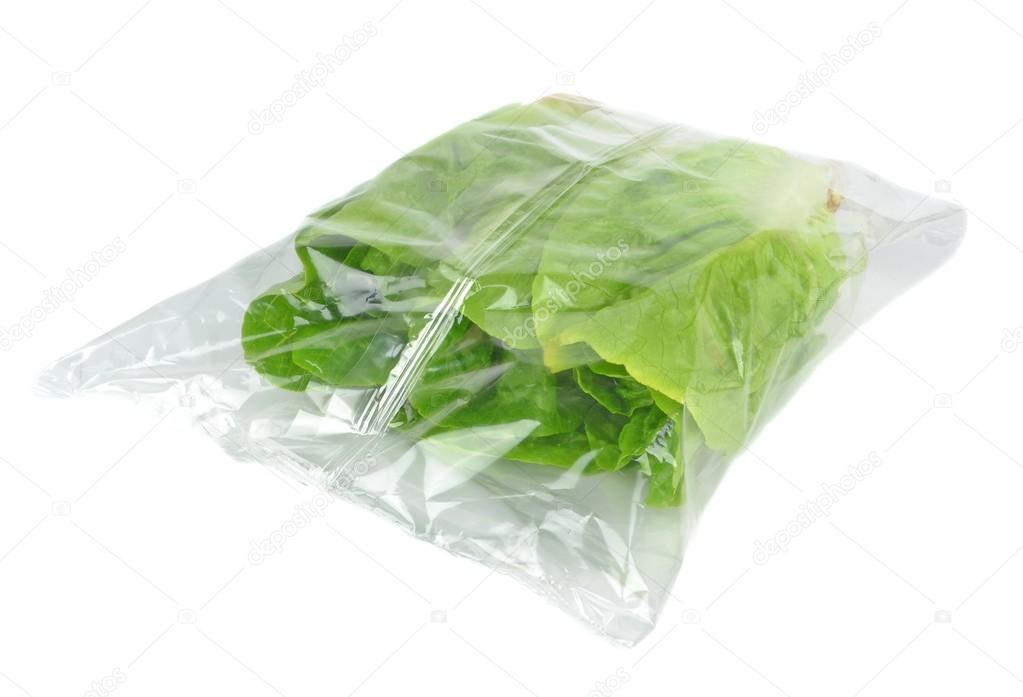 A sealed plastic bag of lettuce