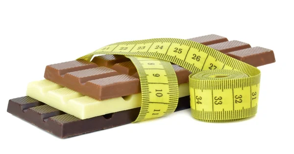 Chocolate bars with a measuring tape — Stock Photo, Image
