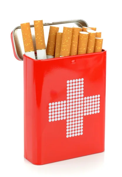 Cigarettes in a first aid tin — Stock Photo, Image