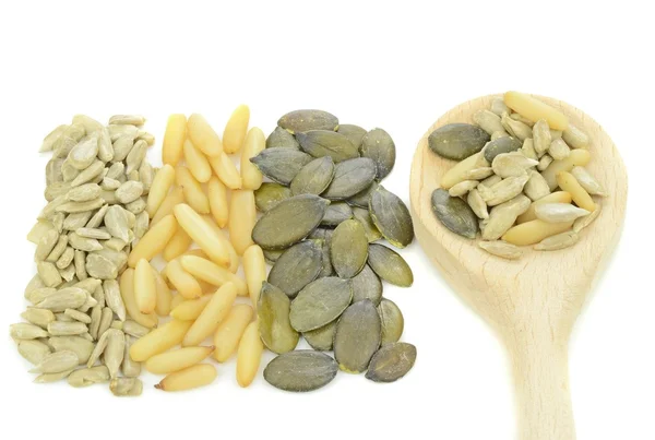 A selection of pine nuts, sunflower, pumpkin seeds — Stock Photo, Image