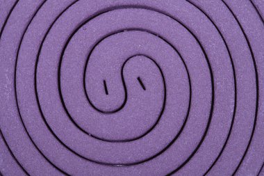 Close up Purple mosquito spiral coil. clipart