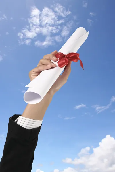 Diploma with a red ribbo — Stock Photo, Image