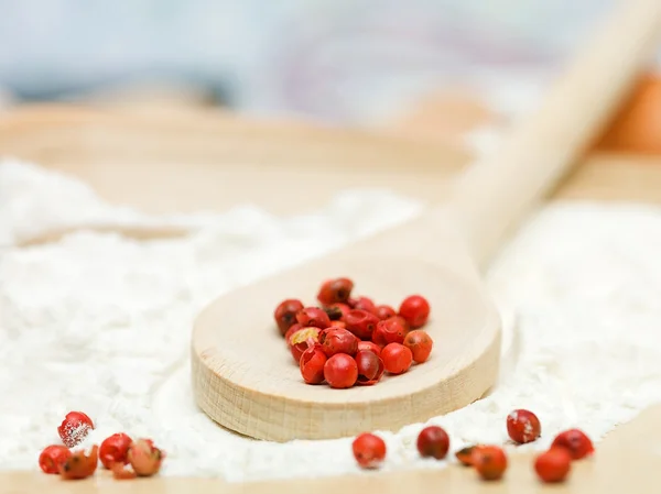 Red pepper placed on a wooden spoon — Stock Photo, Image