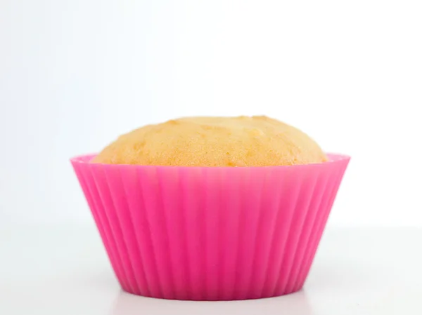 Einzelne einfache Cupcake in rosa Silikonform — Stockfoto