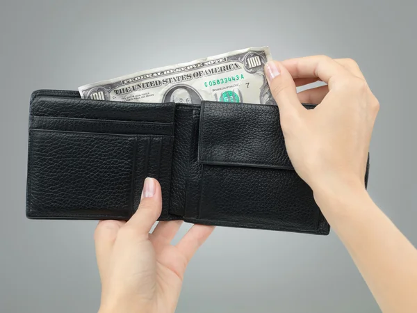 Hands removing crumbled money from wallet — Stock Photo, Image