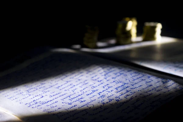 Economics Concept Chiaroscuro Manuscript Some Coins — Stock Photo, Image