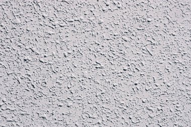 Doku duvarı arkaplanı kil çimento sıva yüzeyini yakın plan düşürür.