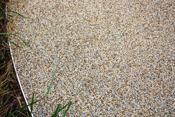 Safety cover of crumb rubber for playgrounds