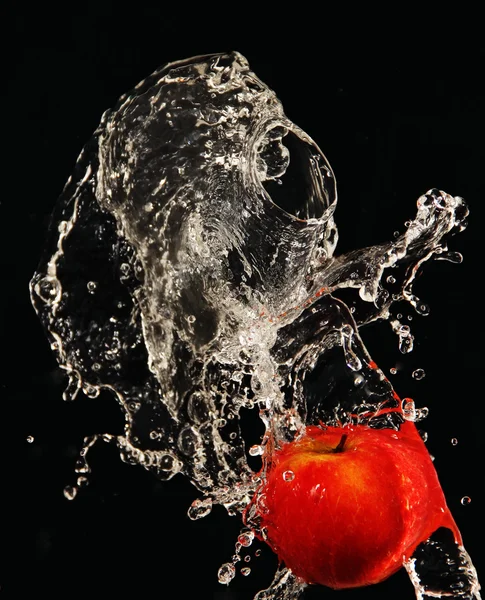 Apple under running water. — Stock Photo, Image
