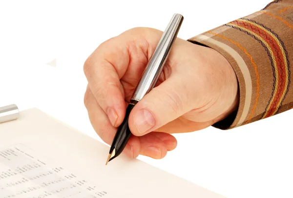 Hand with a pen. signature on the document.