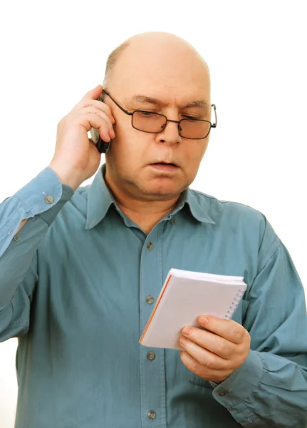 Man with notebook and phone. Stock Image