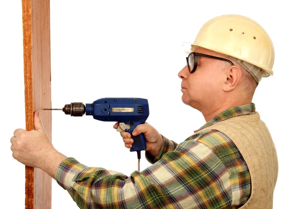 Man with an electric drill. — Stock Photo, Image