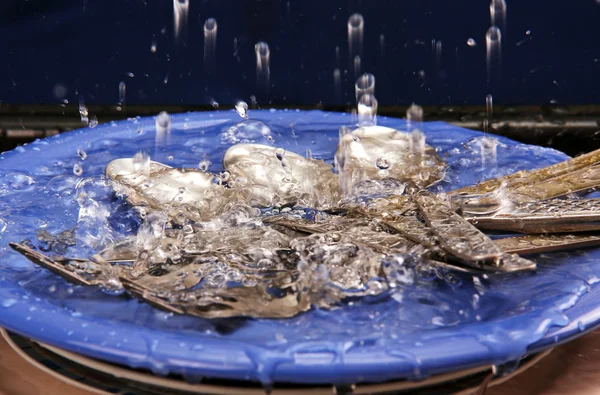 Cutlery under running water. — Stock Photo, Image