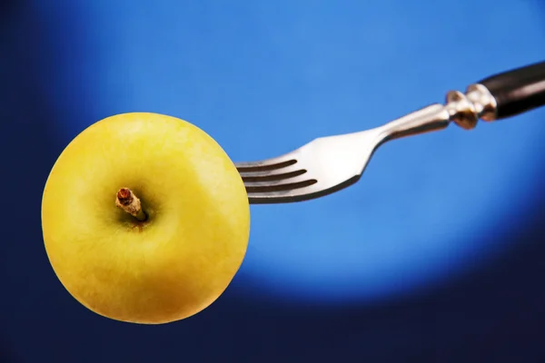 Apple on a fork. — Stock Photo, Image