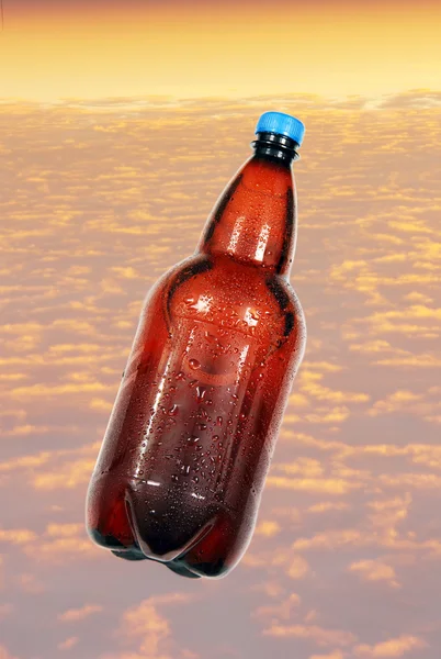 Bottle of beer on background sky. — Stock Photo, Image