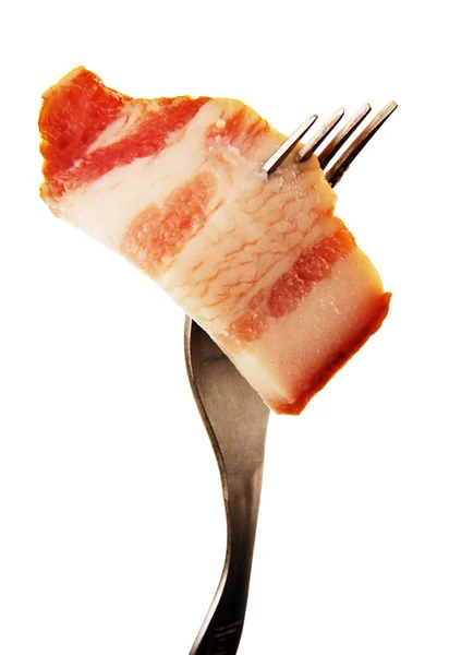 A slice of ham on a steel fork. — Stock Photo, Image