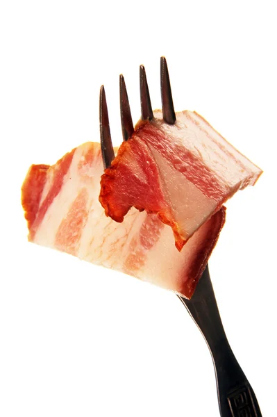 A slice of ham on a steel fork. — Stock Photo, Image