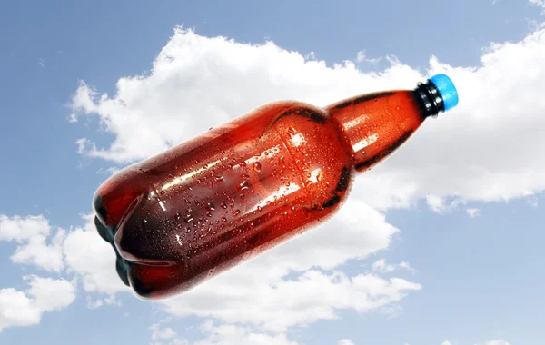 Bottle of beer on background sky. — Stock Photo, Image