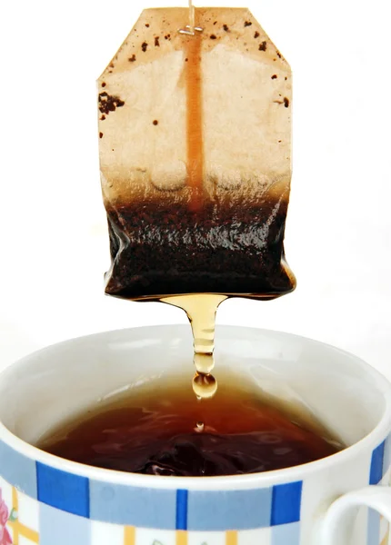 Šálek čaje a sáček čaje. — Stock fotografie