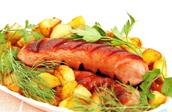 Grilled sausage with garnish on the plate. — Stock Photo, Image