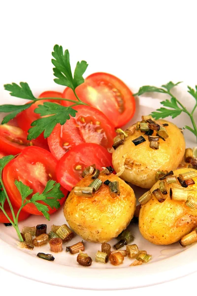 Roasted potatoes with tomatoes. — Stock Photo, Image