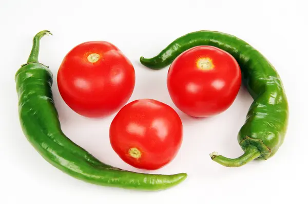 Green peppers and red tomatoes. — Stock Photo, Image