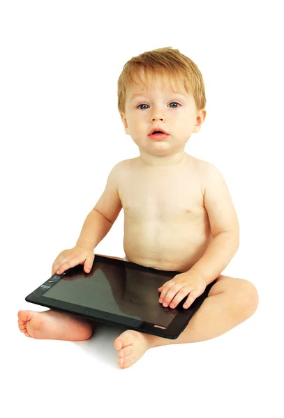 Kleine jongen op de Tablet PC. Stockfoto