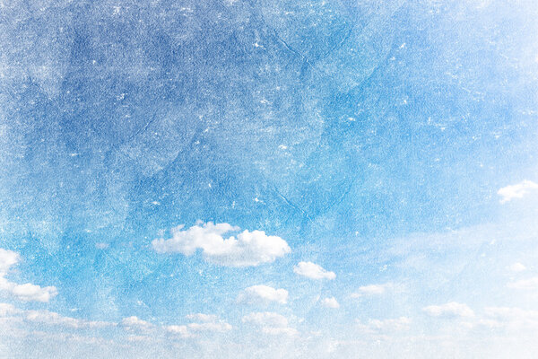 Grunge image of a sky with sun and clouds background