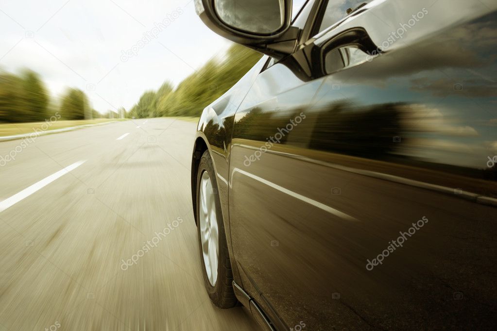 Blurred road and car