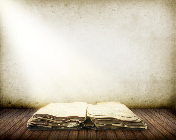 Old book on wood with Ray of light background