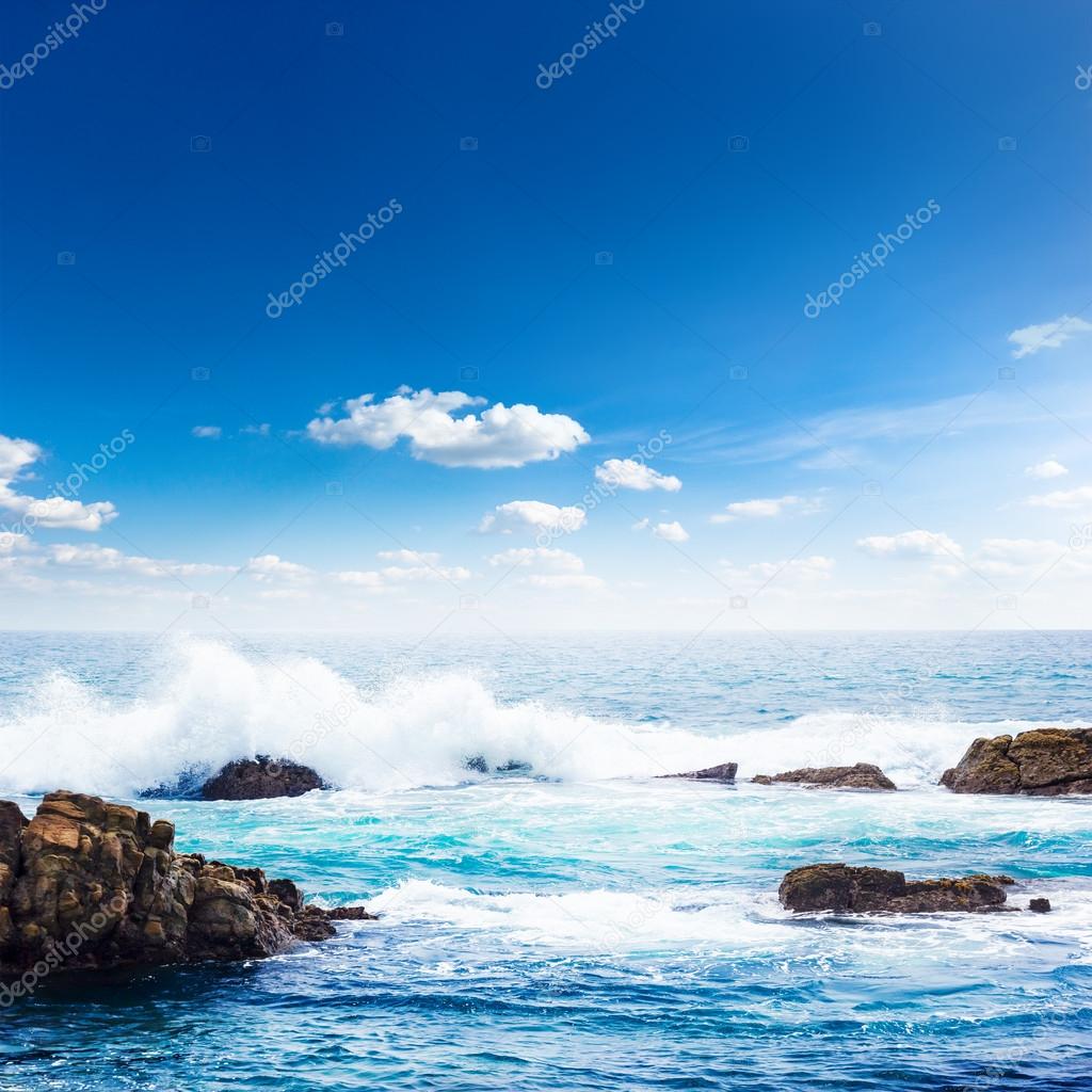 Blue seascape under clouds sky