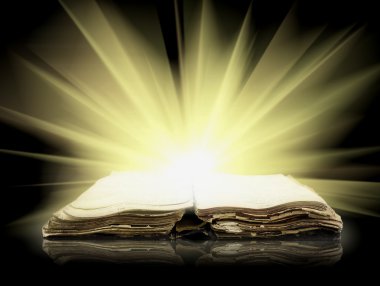 Old bible book with Ray of light clipart