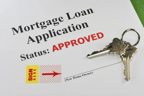 Godkända fastigheter mortgage lån dokument redo för signatur Stockfoto