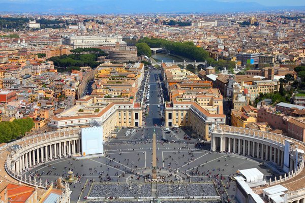 Rome, Italy. Famous Saint Peter's Square in Vatican and aerial view of the city. UNESCO World Heritage Site.