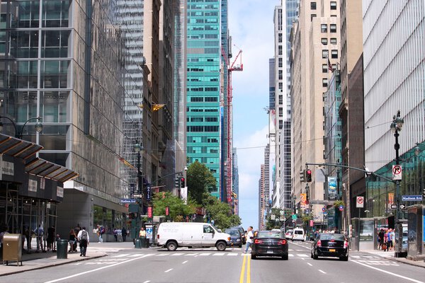 NEW YORK, USA - JULY 4, 2013: People walk along 42nd Street in New York. Almost 19 million people live in New York City metropolitan area.