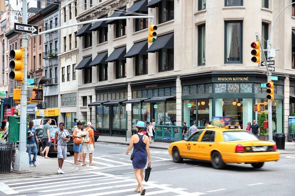 NEW YORK, USA - JULY 4, 2013: People walk in Lower Manhattan in New York. Circa 19 million people live in New York City metropolitan area.