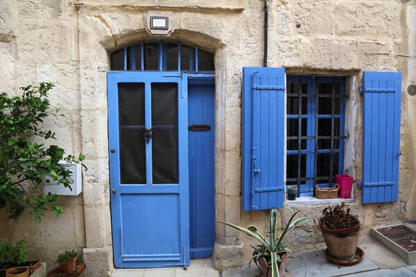 Arles, France. Quaint blue door of a residential building in Arles.