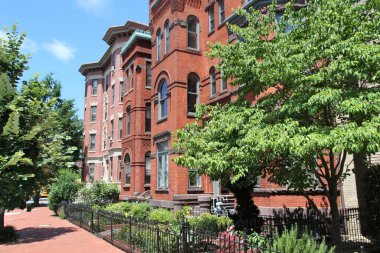 Capitol Hill residential street in Washington DC, USA. Brick generic townhouses.