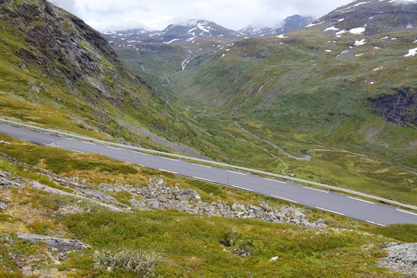 Steep mountain road in Norway. Jotunheimen mountains summer landscape. Sognefjell Road.